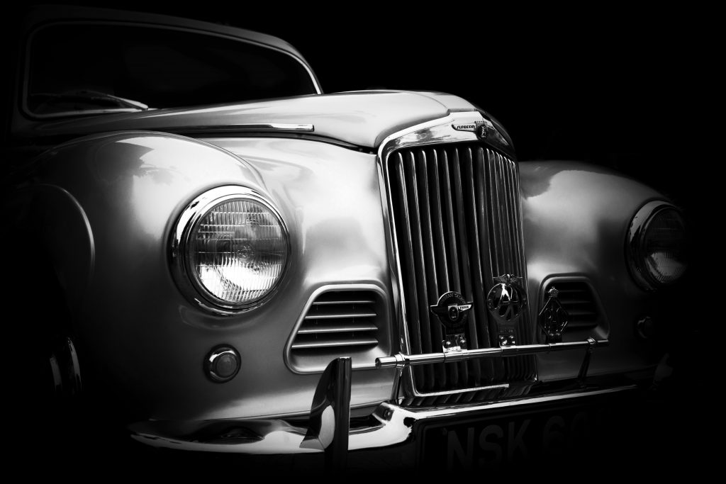 Front view of classic car with a polished metal surface.